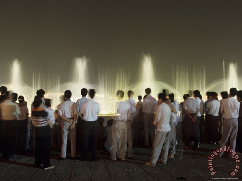 Chinese People Watching a Lighted Musical Water Fountain at Night painting - Raymond Gehman Chinese People Watching a Lighted Musical Water Fountain at Night Art Print