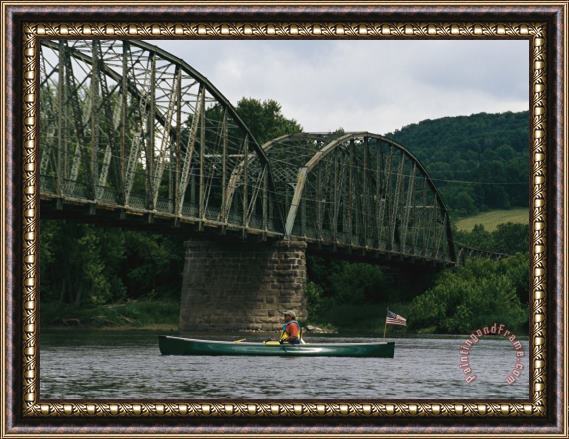 Raymond Gehman A Canoeist Passes Under a Bridge on The Susquehanna River Framed Painting