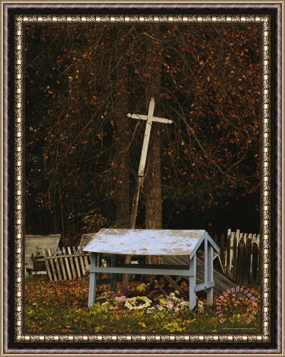 Raymond Gehman A Cross Leans Against a Tree in a Cemetery at St Annes Church Framed Print