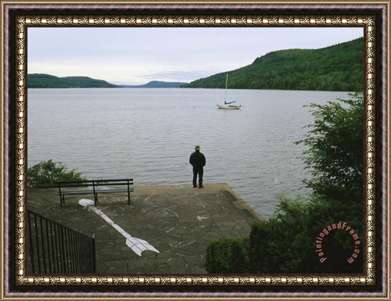 Raymond Gehman A Man Looks Out at a Sailboat Anchored on Otsego Lake Framed Painting