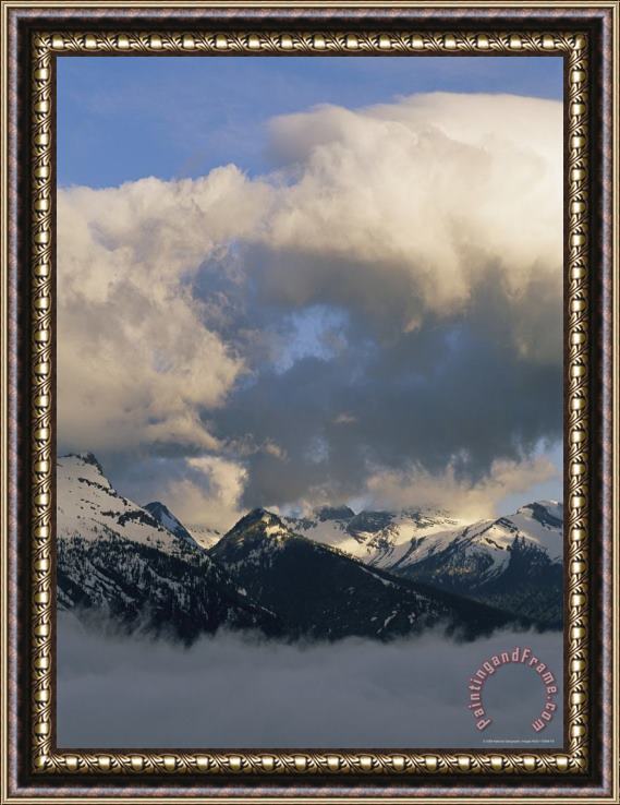 Raymond Gehman Clouds Hover Above And Below Heavens Peak Framed Print