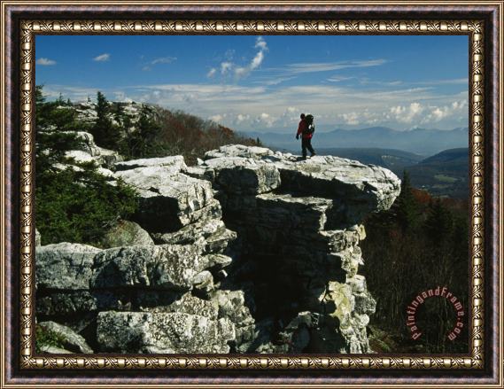 Raymond Gehman Hiker Standing at The Edge of a Rock Outcrop on a Mountain Framed Painting