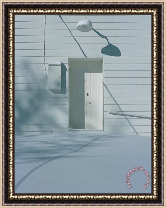 Raymond Gehman Snow Blends in with The Doorway of a White Building Framed Print