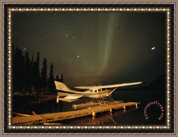 Raymond Gehman The Aurora Borealis Glows Brightly Over a Seaplane Docked on Cli Lake Framed Painting