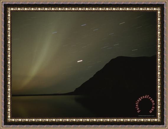 Raymond Gehman The Aurora Borealis Puts on a Light Show Above The Mackenzie River Framed Painting