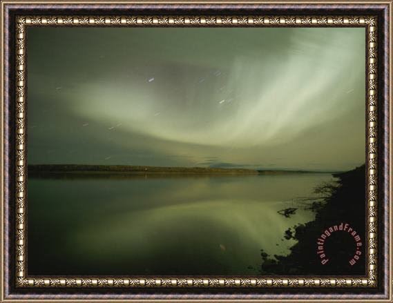 Raymond Gehman The Aurora Borealis Puts on a Light Show Above The Mackenzie River Framed Painting