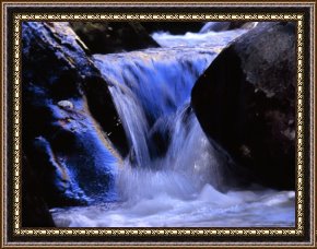 The Waterfall Framed Paintings - Water Cascading Over Stones in a Gentle Small Waterfall by Raymond Gehman