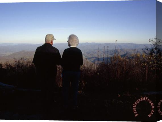 Raymond Gehman An Old Couple Taking in a Scenic View From Wayah Bald at Dusk Stretched Canvas Print / Canvas Art
