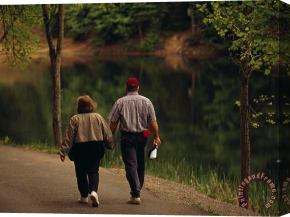 Raymond Gehman Couple Walking by The Water Along a Park Road Stretched Canvas Painting / Canvas Art