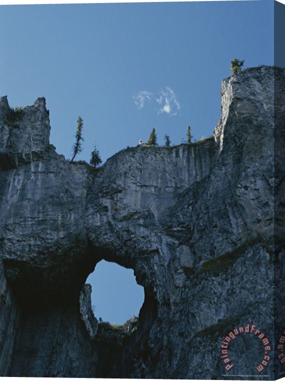 Raymond Gehman Erosion Carves a Window Into Limestone Rock in Nahanni National Park Stretched Canvas Painting / Canvas Art