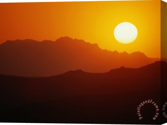 Raymond Gehman Sunset Over Silhouetted Mountain Ridges Stretched Canvas Print / Canvas Art