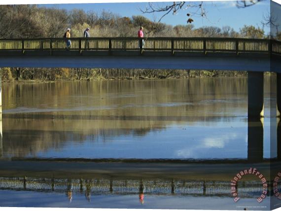 Raymond Gehman Three Men Cross a Footbridge Between Rosslyn And The Potomac River Stretched Canvas Print / Canvas Art