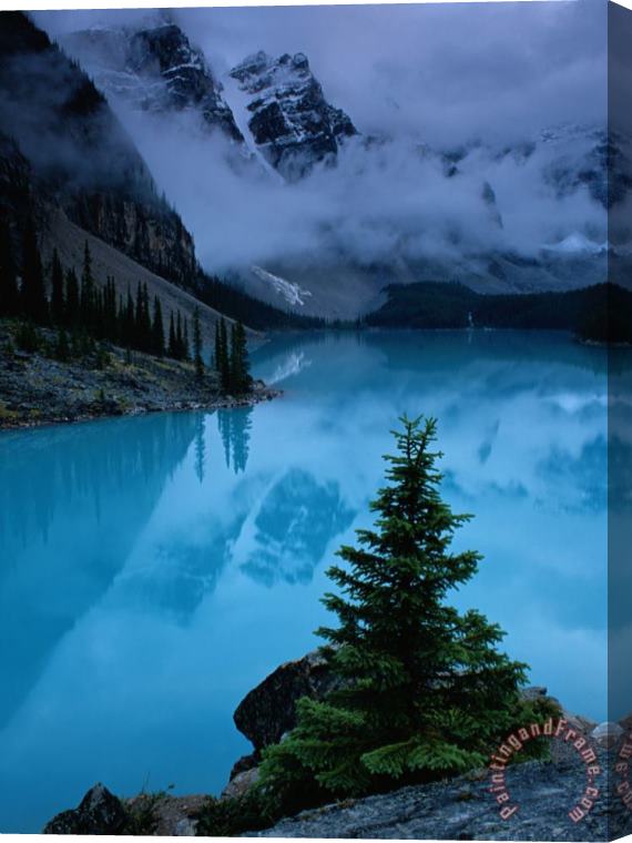 Raymond Gehman View of Moraine Lake with Low Lying Clouds at One End Stretched Canvas Print / Canvas Art