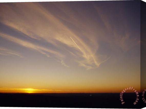 Raymond Gehman Wispy Clouds And Jet Vapor Trail in The Sky at Sunset Stretched Canvas Painting / Canvas Art