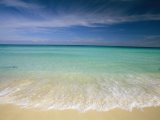 Clear Blue Water And Wispy Clouds Along The Beach at Cancun by Collection