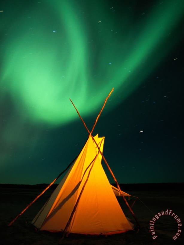A Solitary Tepee Is Illuminated by The Aurora Borealis painting - Raymond Gehman A Solitary Tepee Is Illuminated by The Aurora Borealis Art Print