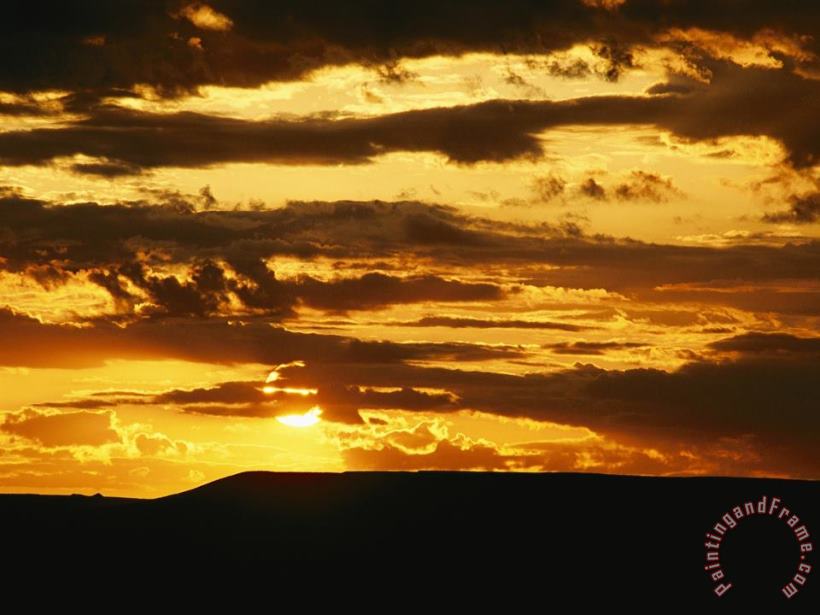 Raymond Gehman Clouds Are Colored Shades of Orange by The Low Sun Over 70 Mile Butte Art Print
