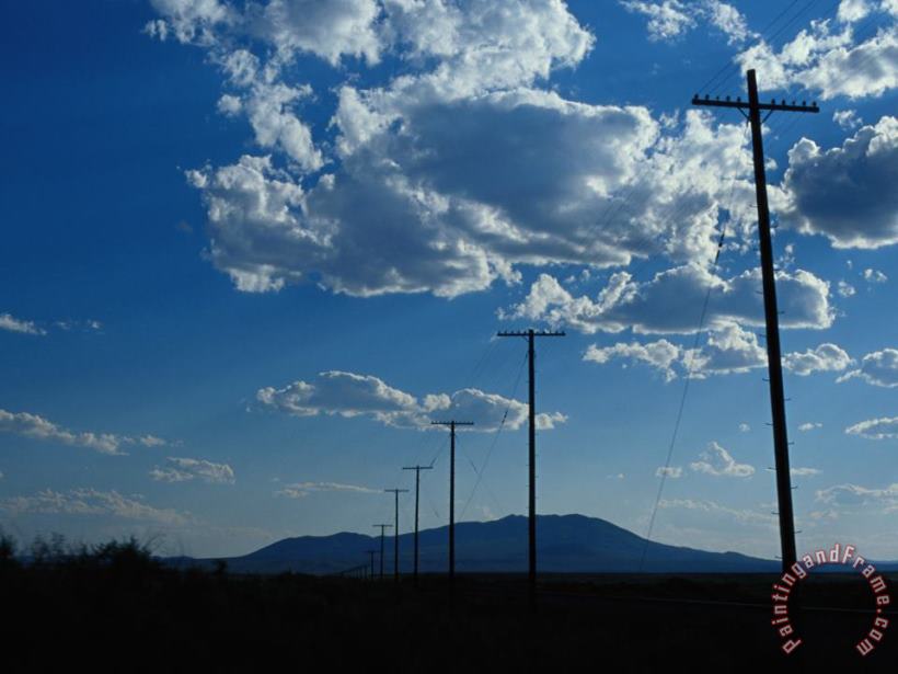 Raymond Gehman Silhouetted Telephone Poles Under Puffy Clouds Art Print
