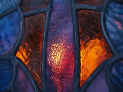 Raymond Gehman Sunset Illuminates a Stained Glass Window of a Church