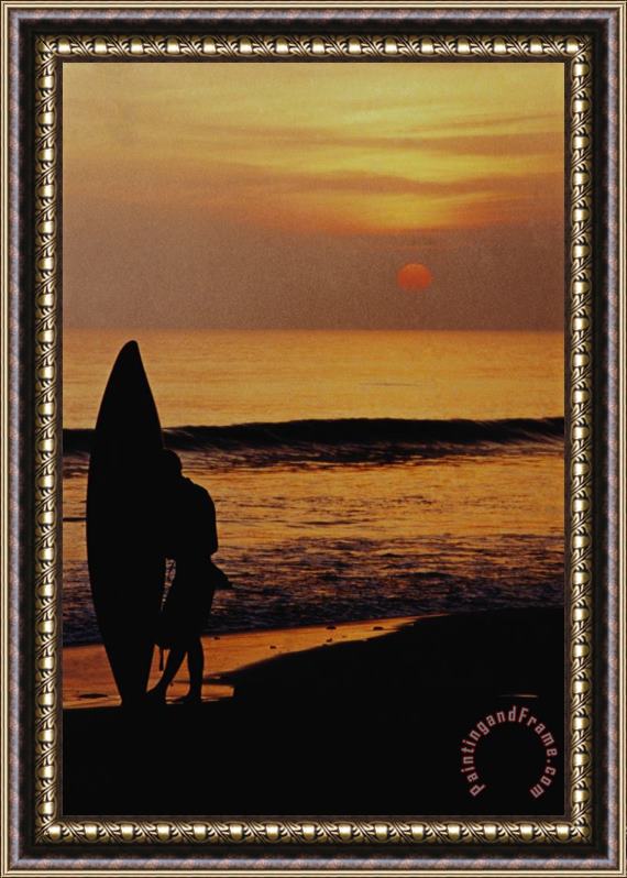 Others Surfing At Sunset Framed Print