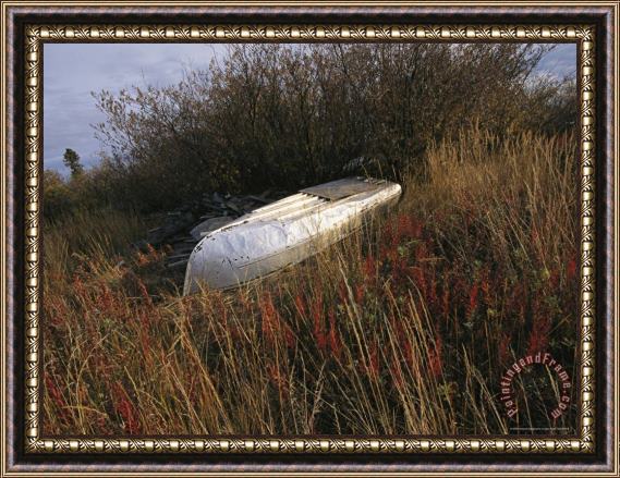 Raymond Gehman A Boat Rests Upside Down on The Shore of The Mackenzie River Framed Print