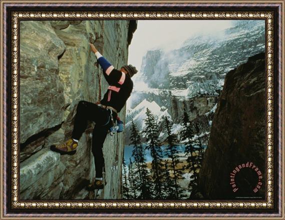 Raymond Gehman A Climber Ascends The Quartzite Cliffs at The End of Lake Louise Framed Print
