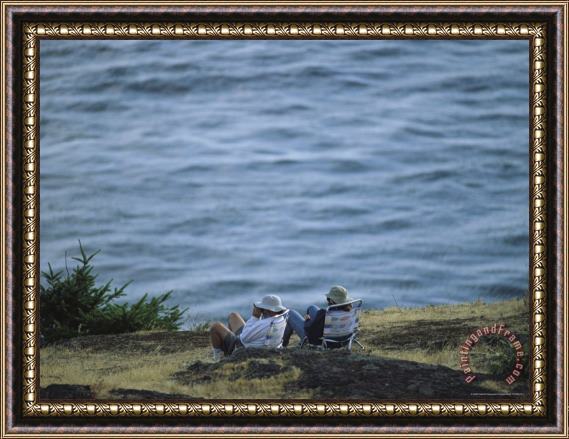 Raymond Gehman A Couple Sits on a Shore Observing Killer Whales Swimming Offshore Framed Painting