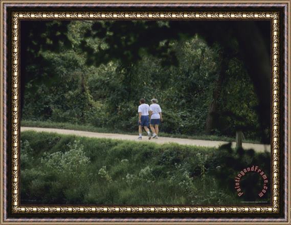 Raymond Gehman A Couple Walks on The Towpath of The Chesapeake And Ohio Canal Framed Painting