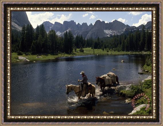 Raymond Gehman A Guide Leads a Pack String Across The North Popo Agie River Below Cirque of The Towers Peaks Framed Print