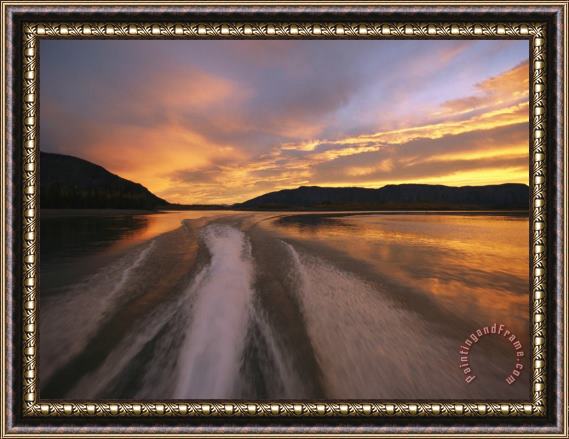 Raymond Gehman A Jet Boat Leaves a Wake in The Mackenzie River at Sunset Framed Painting
