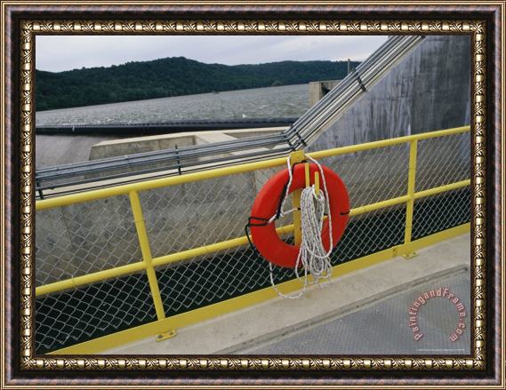 Raymond Gehman A Life Preserver Hangs on a Fence at The Holtwood Hydroelectric Dam Framed Print