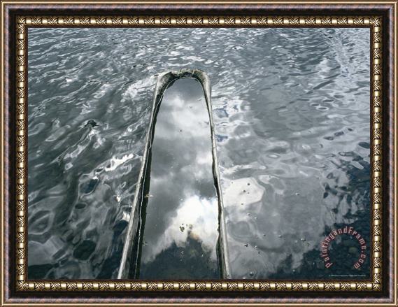 Raymond Gehman A Log Canoe Is Submerged Into Otsego Lake Framed Print