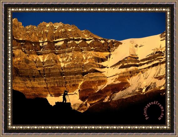 Raymond Gehman A Photographer Is Silhouetted Against a Dramatic Mountain Backdrop Framed Painting