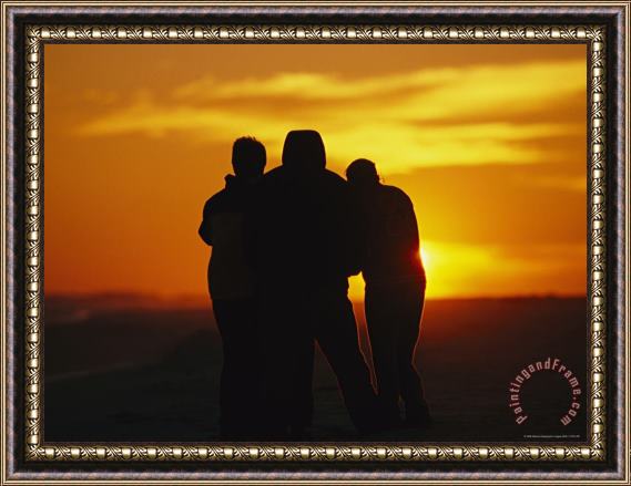 Raymond Gehman A Silhouetted Family Watches a Dramatic Sunset Framed Print