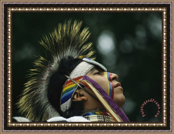 Raymond Gehman A Stoney Indian Brave Wears Ceremonial Headgear During a Festival Framed Print