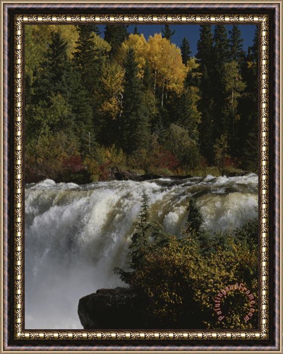 Raymond Gehman A Waterfall Cascades Past Forests Bright with Autumn Foliage Framed Print