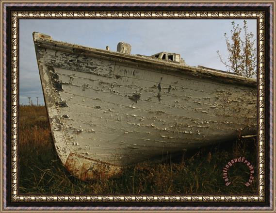 Raymond Gehman A Wooden Boat Lies Abandoned at The Hay River Shipyard Framed Painting