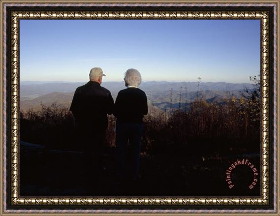 Raymond Gehman An Old Couple Taking in a Scenic View From Wayah Bald at Dusk Framed Painting