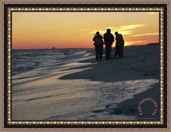 Raymond Gehman Backlit View of People Watching The Sunset From The Shoreline Framed Print