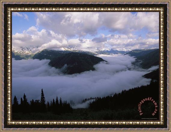 Raymond Gehman Clouds Shroud The Valley And Fill The Sky Along Logan Pass Framed Painting