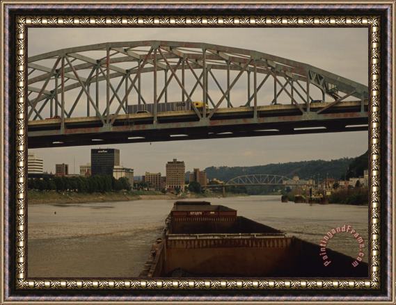 Raymond Gehman Coal Barge Passing Under a Bridge on an American River Framed Painting