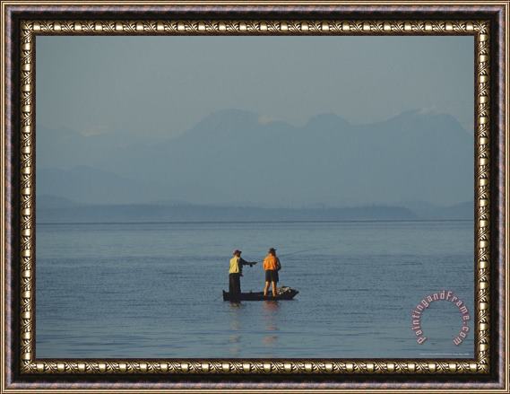 Raymond Gehman Fishermen in a Boat Cast Lines Within Sight of a Hazy Mountain Framed Print