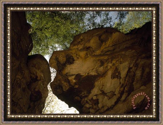 Raymond Gehman Looking Up at Large Over Hanging Boulders in a Wooded Setting Framed Print