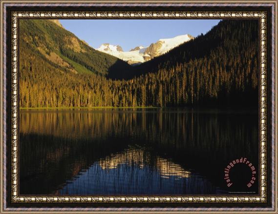 Raymond Gehman Snow Capped Mountains Reflect in a Lake Framed Painting