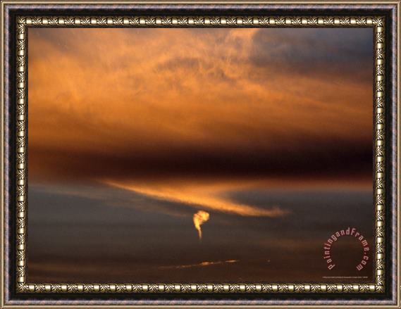 Raymond Gehman Strange Comma Like Cloud Formation at Sunset Framed Print