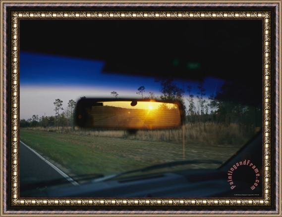 Raymond Gehman Sunrise Appears in a Drivers Rear View Mirror Framed Painting