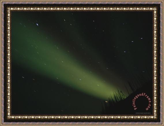 Raymond Gehman The Aurora Borealis Glows Brightly Over The Mackenzie River Framed Painting