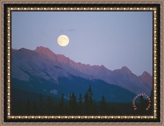 Raymond Gehman The Full Moon Over Mountains Lit by Low Sunlight Framed Print