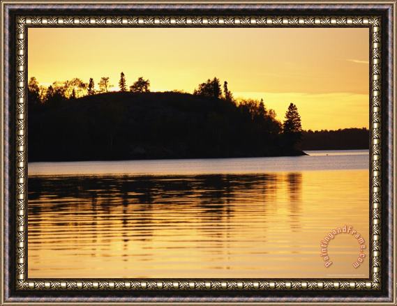 Raymond Gehman The Setting Sun Casts a Golden Glow Over Manitoba S White Lake Framed Print