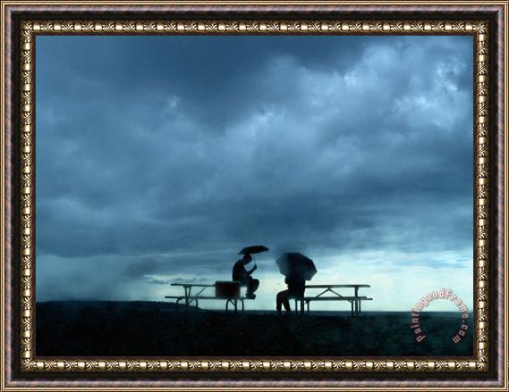 Raymond Gehman Tourists Sit on Picnic Tables While Waiting Out a Storm Framed Painting
